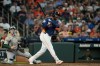 Houston Astros' Yordan Alvarez, right, reacts after fouling a pitch off his foot in front of Athletics catcher Brian Serven during the fourth inning of a baseball game Sunday, Aug. 23, 2026, in Houston. (AP Photo/David J. Phillip)