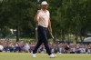 Wyndham Clark celebrates winning on the 18th green in the final round of the BMW Championship golf tournament, Sunday, Aug. 23, 2026, in St. Louis. (AP Photo/Jeff Roberson)