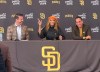 New San Diego Padres owners Kwanza Jones, center, and José E. Feliciano, right, speak at a news conference with team CEO Erik Greupner, left, at Petco Park in San Diego, Calif., Monday, Aug. 24, 2026. (AP Photo/Greg Beacham)
