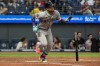 Arizona Diamondbacks' Ketel Marte watches his double off Cleveland Guardians starting pitcher Parker Messick during the fourth inning of a baseball game, Saturday, Aug. 1, 2026, in Cleveland. (AP Photo/Phil Long)