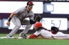 Washington Nationals' CJ Abrams, right, slides into second base for a steal ahead of a tag by Colorado Rockies second baseman Connor Norby during the first inning of a baseball game in Washington, Monday, Aug. 24, 2026. (AP Photo/Terrance Williams)