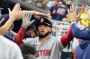 Boston Red Sox's Wilyer Abreu is congratulated in the dugout after scoring on a wild pitch thrown by Miami Marlins relief pitcher Josh Ekness during the eighth inning of a baseball game, Monday, Aug. 24, 2026, in Miami. (AP Photo/Lynne Sladky)