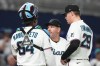 Miami Marlins relief pitcher Pete Fairbanks (29) talks with manager Clayton McCullough, center, before leaving the game due to an injury during the eighth inning of a baseball game against the Boston Red Sox, Monday, Aug. 24, 2026, in Miami. (AP Photo/Lynne Sladky)