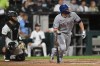 Texas Rangers' Corey Seager, right, watches his two-run double during the third inning of a baseball game against the Chicago White Sox in Chicago, Monday, Aug. 24, 2026. (AP Photo/Paul Beaty)