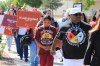 FILE - Tize W. Clark, right and his son, Zion Clark, participate in a walk to honor Native American and Indigenous relatives who have gone missing or have been killed as Missing and Murdered Indigenous Persons Awareness Day is marked in Albuquerque, New Mexico, on May 5, 2025. (AP Photo/Susan Montoya Bryan,File)