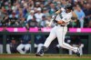 Seattle Mariners' Cal Raleigh hits a two-run home run against the Philadelphia Phillies during the first inning of a baseball game, Monday, Aug. 24, 2026, in Seattle. (AP Photo/Lindsey Wasson)