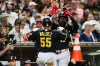 Pittsburgh Pirates' Esmerlyn Valdez (55) is congratulated by Oneil Cruz, center right, after hitting a solo home run against the San Diego Padres in the sixth inning of a baseball game Monday, Aug. 24, 2026, in San Diego. (AP Photo/Derrick Tuskan)