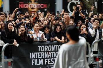 Fans cheer as Adriana Paz arrives on the red carpet for the premiere of 'Emilia Perez' at the Princess of Wales Theatre during the Toronto International Film Festival, in Toronto, on Monday, Sept. 9, 2024. THE CANADIAN PRESS/Cole Burston