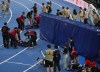 Humanoid robots are carried off the track after competing in the 100m race during the World Humanoid Robot Games in Beijing, Tuesday, Aug. 25, 2026. (AP Photo/Achmad Ibrahim)