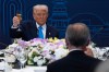 U.S. President Donald Trump looks toward Canadian Prime Minister Mark Carney as they raise their glasses during a toast at a working dinner in Gyeongju, South Korea on Wednesday, Oct. 29, 2025. THE CANADIAN PRESS/Adrian Wyld