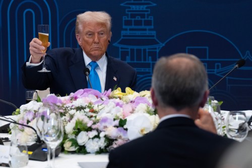 U.S. President Donald Trump looks toward Canadian Prime Minister Mark Carney as they raise their glasses during a toast at a working dinner in Gyeongju, South Korea on Wednesday, Oct. 29, 2025. THE CANADIAN PRESS/Adrian Wyld