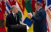 Prime Minister Mark Carney speaks with Saskatchewan Premier Scott Moe before a meeting at the First Minister's Meeting on Thursday, Jan. 29, 2026.  THE CANADIAN PRESS/Adrian Wyld