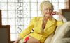 FILE - Dolly Parton poses for a photo at her office in Nashville, Tenn., Aug. 11, 2005. (AP Photo/John Russell, File)