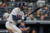 Houston Astros' Yordan Alvarez (44) follows through on a RBI triple during the eighth inning of a baseball game against the New York Yankees Tuesday, Aug. 25, 2026, in New York. (AP Photo/Frank Franklin II)
