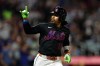 New York Mets' Francisco Lindor reacts after hitting a solo home run during the fifth inning of a baseball game against the Milwaukee Brewers, on Tuesday, Aug. 25, 2026, in New York. (AP Photo/Adam Hunger)
