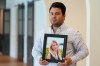 Harold Jezler poses for a picture with a photo of his wife, Olga Jezler, in West Harrison, N.Y., Friday, Aug. 21, 2026. (AP Photo/Seth Wenig)