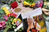 Dolly Parton's star on the Hollywood Walk of Fame is decorated with flowers Tuesday, Aug. 25, 2026, in Los Angeles. (AP Photo/Chris Pizzello)