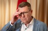 Saskatchewan Premier Scott Moe adjusts his glasses as he speaks with reporters in Mumbai, India, Friday, Feb. 27, 2026. THE CANADIAN PRESS/Adrian Wyld