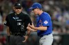 Chicago Cubs manager Craig Counsell, right, argues with home plate umpire Alfonso Márquez during the sixth inning of a baseball game against the Arizona Diamondbacks, Wednesday, Aug. 26, 2026, in Phoenix. (AP Photo/Ross D. Franklin)
