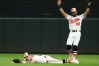Baltimore Orioles right fielder Tyler O'Neill, left, reacts after making a diving catch as center fielder Leody Taveras (30) celebrates on a ball hit by Tampa Bay Rays' Richie Palacios during the ninth inning of a baseball game in Baltimore, Saturday, Aug. 22, 2026. (AP Photo/Terrance Williams)