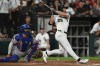 Chicago White Sox's Tristan Peters watches his two-run home during the fifth inning of a baseball game against the Texas Rangers in Chicago, Wednesday, Aug. 26, 2026. (AP Photo/Paul Beaty)