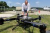Volatus Aerospace COO Greg Colacitti inspects a heavy lift drone before a test run on July 13, 2026, in Kleinburg, Ontario. (AP Photo/Kelvin Chan)