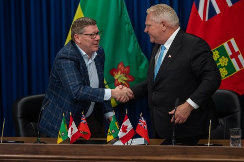 Premier of Saskatchewan Scott Moe, left, and Premier of Ontario Doug Ford shake hands during a media event to sign a Memorandum of Understanding in Saskatoon on Sunday, June 1, 2025. THE CANADIAN PRESS/Liam Richards