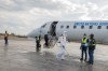 A health worker disinfects the airport following the government's announcement of Bunia National Airport's reopening in Bunia, Congo, Tuesday, June 2, 2026. (AP Photo/Moses Sawasawa)