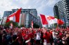 Canada fans march to B.C. Place stadium before Canada and Switzerland play a World Cup Group B soccer match, in Vancouver, on Wednesday, June 24, 2026. THE CANADIAN PRESS/Jacob Mallari