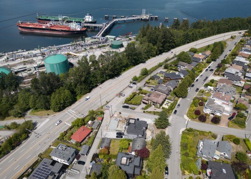 Crude oil tankers SFL Sabine, front left, and Tarbet Spirit are seen docked at the Trans Mountain Westridge Marine Terminal, where crude oil from the expanded Trans Mountain Pipeline is loaded onto tankers, near a residential area in Burnaby, B.C., Monday, June 10, 2024. THE CANADIAN PRESS/Darryl Dyck