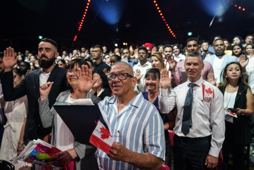 A section of the nearly 400 new Canadians from 65 countries, take oath of citizenship at a ceremony in Toronto, on Friday, July 19, 2024. THE CANADIAN PRESS/Chris Young