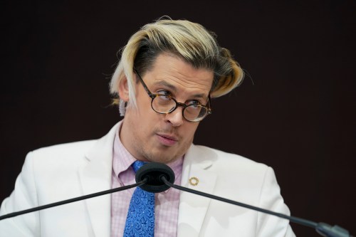 FILE - Activist Milo Yiannopoulos speaks during a rally outside of the Baltimore hotel where the United States Conference of Catholic Bishops are holding its Fall General Assembly meeting in Baltimore, Nov. 16, 2021. (AP Photo/Julio Cortez, File)