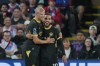 Manchester City's Rayan Cherki, right, celebrates with Erling Haaland after scoring his side's third goal during the English Premier League soccer match between Crystal Palace and Manchester City in London, Friday, Aug. 28, 2026. (AP Photo/Kin Cheung)