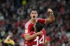 Bayern's Aleksandar Pavlovic, top, celebrates after scoring his side's fourth goal with Ismael Saibari during the Bundesliga soccer match between Bayern Munich and VfB Stuttgart in Munich, Germany, Friday, Aug. 28, 2026. (AP Photo/Matthias Schrader)