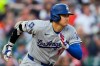 Los Angeles Dodgers' Shohei Ohtani runs out a ground out against the Detroit Tigers during the third inning of a baseball game Friday, Aug. 28, 2026, in Detroit. (AP Photo/Paul Sancya)