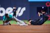 Seattle Mariners' Randy Arozarena (left) is caught stealing second base by Toronto Blue Jays shortstop Andres Gimenez (0) during third inning MLB baseball action in Toronto, on Friday, Aug. 28, 2026. THE CANADIAN PRESS/Sammy Kogan