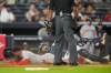 Boston Red Sox' Ceddanne Rafaela is tagged out by New York Yankees catcher Austin Wells at home plate on a double play during the seventh inning of a baseball game, Friday, Aug. 28, 2026, in New York. (AP Photo/Yuki Iwamura)
