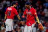 Atlanta Braves' Ronald Acuña Jr., right, celebrates with Mauricio Dubón (14) after their team defeated the Colorado Rockies in a baseball game, Friday, Aug. 28, 2026, in Atlanta. (AP Photo/Erik S. Lesser)