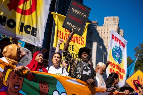FILE - Protestors march through Manhattan up to Central Park during the 