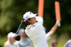 Ruoning Yin, of China, hits the 13th tee during the first round of the LPGA FM Championship golf tournament in Norton, Mass., Thursday, Aug. 27, 2026. (AP Photo/Charles Krupa)