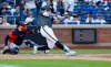 New York Mets Juan Soto hits an RBI single against the Houston Astros during the fifth inning of a baseball game, Saturday, Aug. 29, 2026, in New York. (AP Photo/Noah K. Murray)