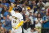 Milwaukee Brewers' William Contreras gestures as he rounds the bases after hitting a solo home run during the first inning of a baseball game against the Texas Rangers, Saturday, Aug. 29, 2026, in Milwaukee. (AP Photo/Aaron Gash)