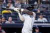 New York Yankees' Jazz Chisholm Jr. hits a sacrifice fly, scoring Ben Rice, in the third inning during the second baseball game of a doubleheader against the Boston Red Sox, Saturday, Aug. 29, 2026, in New York. (AP Photo/Corey Sipkin)