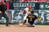Pittsburgh Pirates' Nick Gonzales is caught stealing by St. Louis Cardinals shortstop JJ Wetherholt during the seventh inning of a baseball game, Saturday, Aug. 29, 2026, in St. Louis. (AP Photo/Jeff Le)