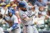 Texas Rangers' Ezequiel Duran hits a two-RBI double against the Milwaukee Brewers during the fifth inning of a baseball game Sunday, Aug. 30, 2026, in Milwaukee. (AP Photo/Jeffrey Phelps)