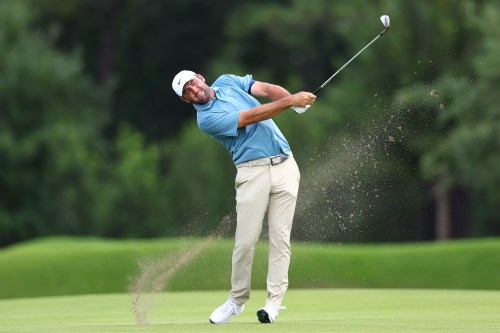 Scottie Scheffler hits from the seventh fairway during the final round of the PGA Tour Championship golf tournament Sunday, Aug. 30, 2026, in Atlanta. (AP Photo/Colin Hubbard)