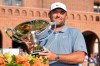 Scottie Scheffler holds the trophy after winning the PGA Tour Championship golf tournament Sunday, Aug. 30, 2026, in Atlanta. (AP Photo/Mike Stewart)