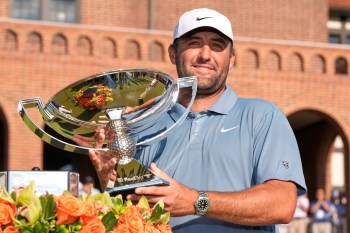 Scottie Scheffler holds the trophy after winning the PGA Tour Championship golf tournament Sunday, Aug. 30, 2026, in Atlanta. (AP Photo/Mike Stewart)
