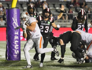 B.C. Lions running back Zander Horvath (34) scores a touchdown during first half CFL action against the Ottawa Redblacks in Ottawa, Sunday, Aug. 30, 2026. THE CANADIAN PRESS/Chris Tanouye