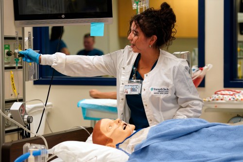 Nursing student Maribel Gonzalez Guzman checks a patient manikin in the simulation lab at Forsyth Technical Community College in Winston-Salem, N.C., Thursday, Aug. 20, 2026. (AP Photo/Chuck Burton)